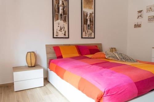 En eller flere senge i et værelse på Grazioso appartamento a due passi dal mare