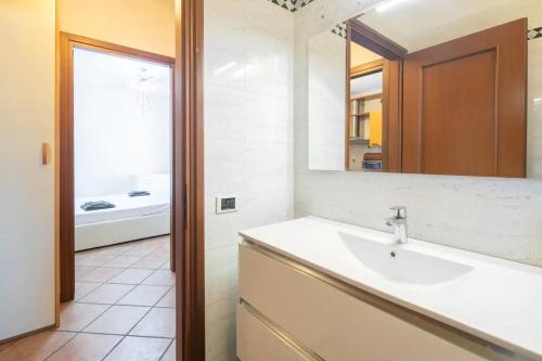 a bathroom with a sink and a mirror at SUITE con 2 Balconi - 6 Guest in Prato