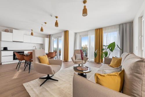 a living room with a couch and a table at Karl und Anton Boutique Apartments in Vienna