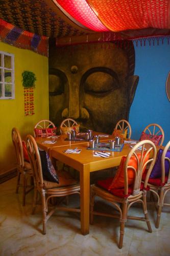 a dining room with a wooden table and chairs at Muthu Clube Praia da Oura in Albufeira