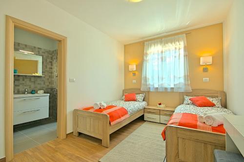 Postel nebo postele na pokoji v ubytování Villa Muskovic - Weingut Muskovic