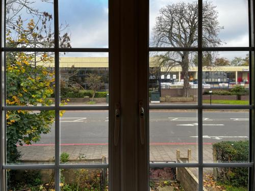 a view of a street from a window at Maberic Housing in Cranford