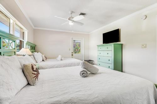 Ένα ή περισσότερα κρεβάτια σε δωμάτιο στο Beach Villa 1B