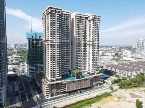 an aerial view of tall buildings in a city at Bali Residences Homestay Melaka Town in Melaka