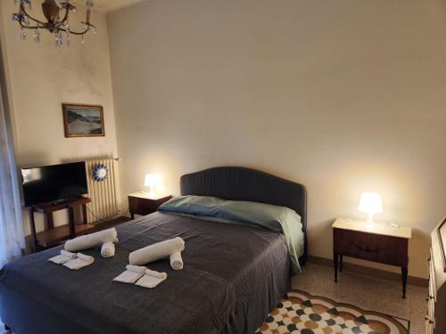 a bedroom with a bed with two towels on it at La grande casa di Puglia in Gioia del Colle