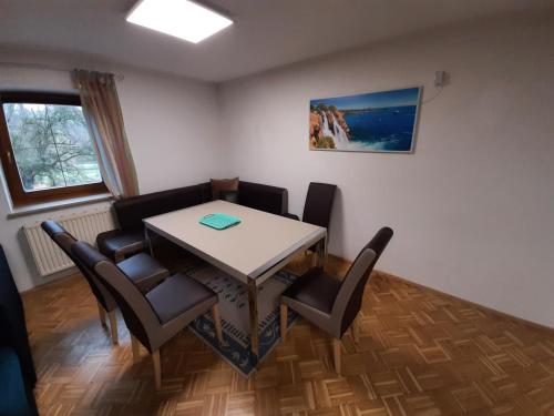 a dining room with a table and chairs at Schöne Wohnung am Bauernhof in Lehen
