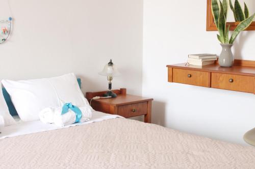 Postel nebo postele na pokoji v ubytování Ostria Rooms