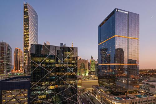 a view of a city skyline with tall buildings at Wyndham Doha West Bay in Doha