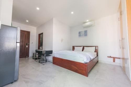 Ένα ή περισσότερα κρεβάτια σε δωμάτιο στο Residence 110 (Hotel and Apartments)
