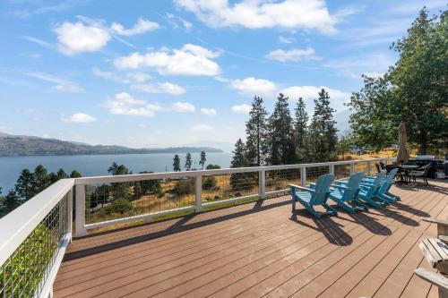 a deck with chairs and a view of the water at Blue Lake Serenity in Hollywood Beach