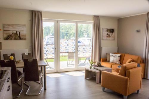 a living room with a couch and a table at 2 Zimmerapartment 2 Terrassen P7a1 in Plau am See