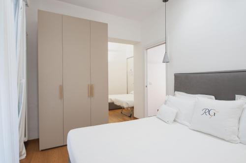 Postel nebo postele na pokoji v ubytování RG7 Apartments