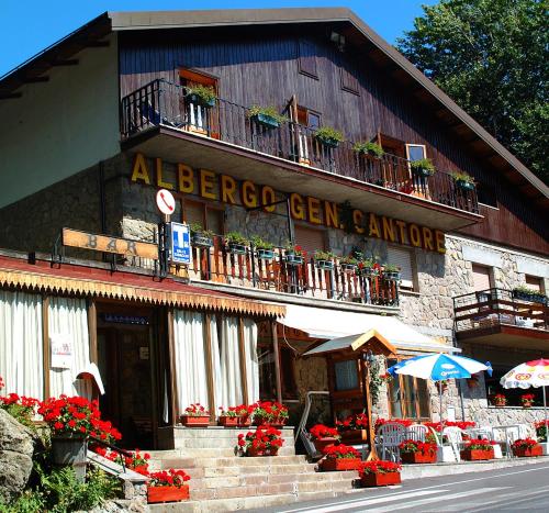 a building with a sign on the side of it at Albergo Generale Cantore - Monte Amiata in Abbadia San Salvatore