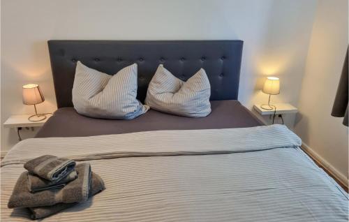 a bed with two pillows and a towel on it at 1 Bedroom Gorgeous Apartment In Passow Ot Charlottenho in Zahren