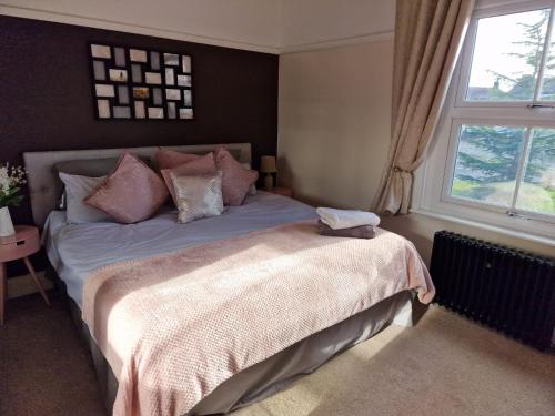 a bedroom with a bed and a window at The Nook Cosby Village in Cosby