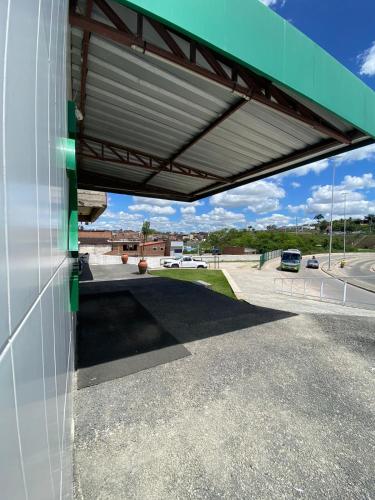 a gas station with awning over a parking lot at Rota 232 Hotel Caruaru in Caruaru