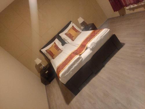 a bedroom with a large bed in a room at Sun-House Pension&Restaurant -ParkingFree- in Prague