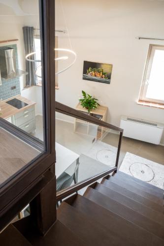 a room with a glass table and a window at A Casa di BiaGio in Rapolano Terme