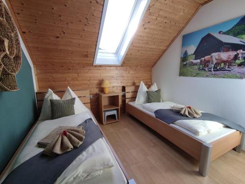 a bedroom with two beds in a attic at Landhaus Seebacher in Spital am Pyhrn