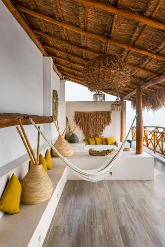a room with a hammock in a resort at Verandah Studios in Playa del Carmen