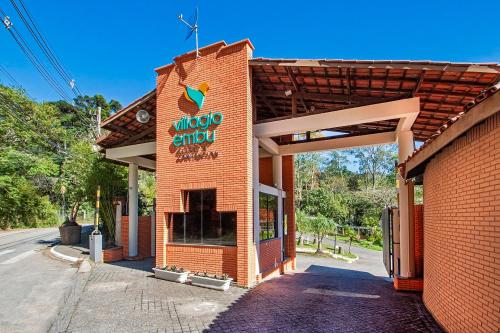 a brick building with a sign on the side of it at Villagio Embu in Embu