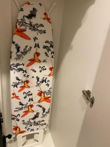 a tie with birds on it in a room at Old town apartment in Kaunas