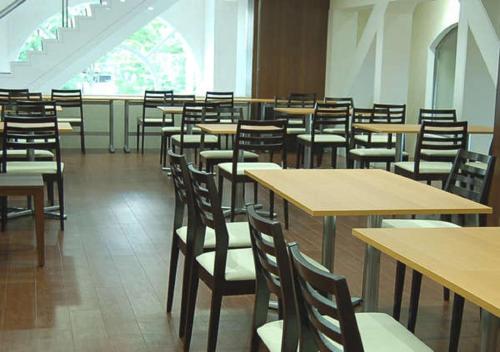 a room full of tables and chairs in a restaurant at Koriyama - Hotel / Vacation STAY 45300 in Koriyama