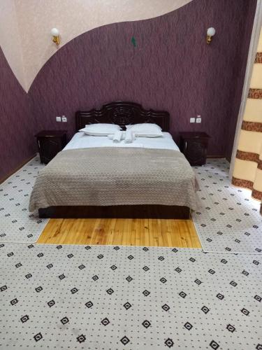 Ένα ή περισσότερα κρεβάτια σε δωμάτιο στο Toj Mahal Hotel