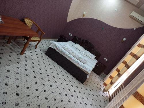 Ένα ή περισσότερα κρεβάτια σε δωμάτιο στο Toj Mahal Hotel