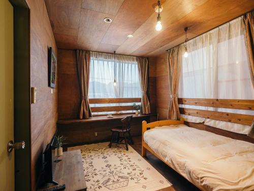 Tempat tidur dalam kamar di Noasobi Lodge 206- Vacation STAY 45777v