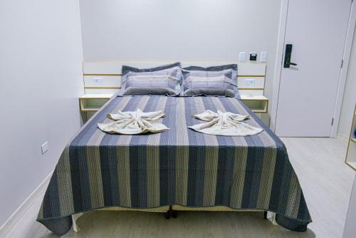 Rúm í herbergi á GUARANY HOTEL PONTA PORÃ