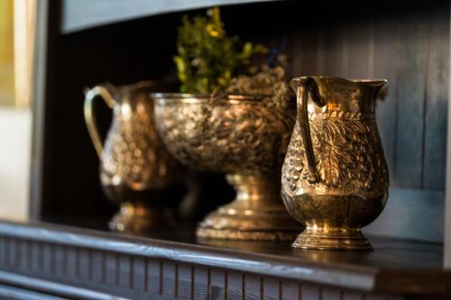a group of vases sitting on a shelf at Villa Daringer in Mayrhofen