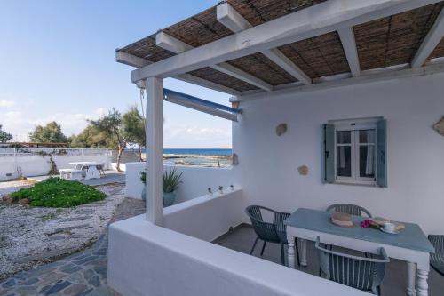 a view of the beach from the patio of a house at Venia's Guesthouse in Pollonia