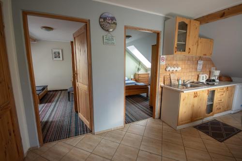 a kitchen with a sink and a counter top at Na Szlaku in Krzeszów