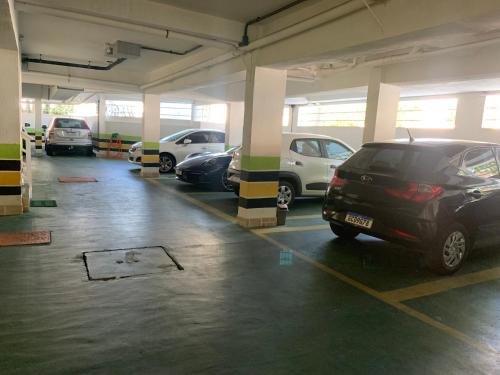 a parking garage with cars parked in it at Hotel The Green Ecologic in Guarujá