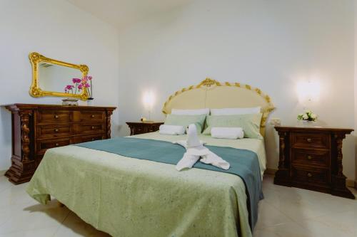 Postel nebo postele na pokoji v ubytování Casa da Maddalena e Andrea