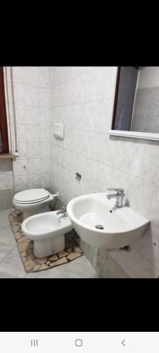 a bathroom with a sink and a toilet at Affittacamere airport orio Bergamo in Orio al Serio