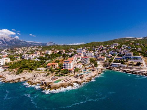 an aerial view of a resort on the water at Apartments Limunada in Utjeha
