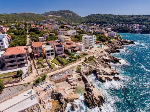 an aerial view of a town on the water at Apartments Limunada in Utjeha