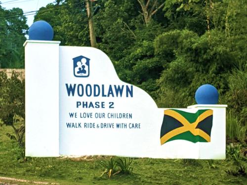 a sign for the woodholm phase we love our children walk rides drive at Oasis Living Getaway in Mandeville, Manchester in Mandeville
