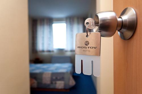 a door with a tag on it with a room at Hotel Rostov in Pleven