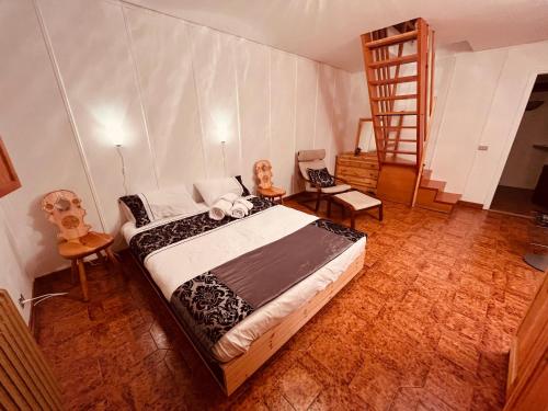 Кровать или кровати в номере La Baita Limone Riserva Bianca Ski-in Ski-out Seggiovia Morel 3