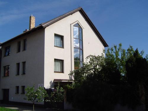 a house with a large window on the side of it at A.V.E. Pension Kliská in Prague