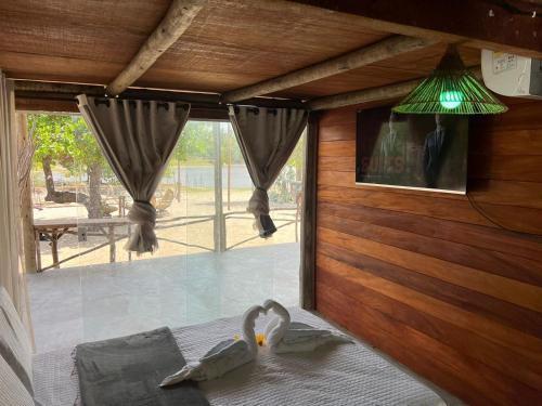 Postel nebo postele na pokoji v ubytování Bangalô Mangue Seco - Jericoacoara ce