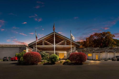 a building with two flags on top of it at The Lodge at Banner Elk in Banner Elk