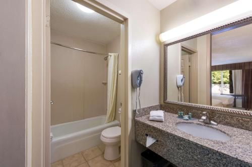 a bathroom with a sink and a toilet and a phone at The Lodge at Banner Elk in Banner Elk