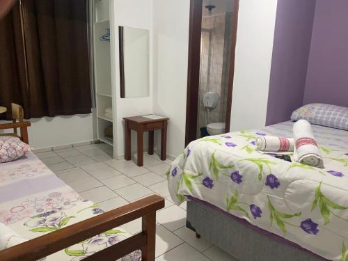 Ένα ή περισσότερα κρεβάτια σε δωμάτιο στο Hotel Interpraias