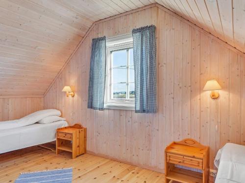 a room with two beds and a window at 6 person holiday home in Brekstad-By Traum in Brekstad