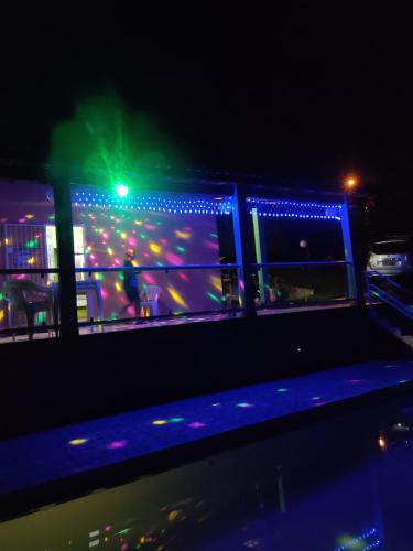 a bowling game is lit up at night at Chácara de Temporada - Mairiporã in Mairiporã