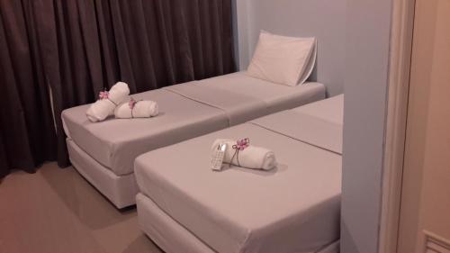 Ένα ή περισσότερα κρεβάτια σε δωμάτιο στο Hotel Rung Phangan
